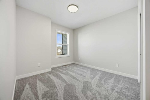1047 Bayview Crescent, Airdrie, AB - Indoor Photo Showing Other Room
