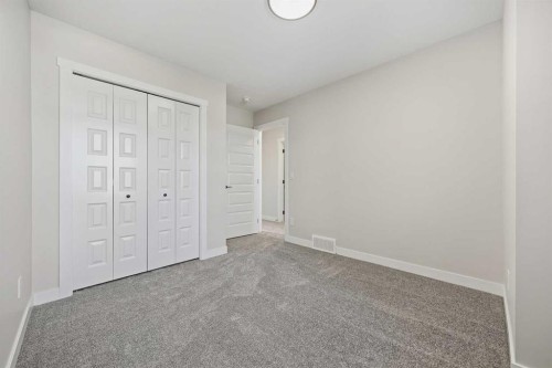 1047 Bayview Crescent, Airdrie, AB - Indoor Photo Showing Other Room
