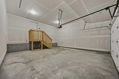 1047 Bayview Crescent, Airdrie, AB - Indoor Photo Showing Garage