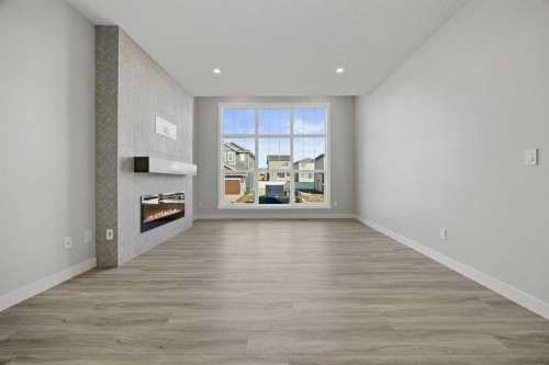 1047 Bayview Crescent, Airdrie, AB - Indoor With Fireplace