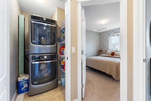 100 Evansborough Common Nw, Calgary, AB - Indoor Photo Showing Laundry Room