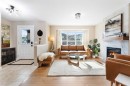 100 Evansborough Common Nw, Calgary, AB  - Indoor Photo Showing Living Room With Fireplace 