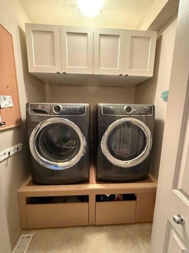 28 West Springs Close Sw, Calgary, AB - Indoor Photo Showing Laundry Room