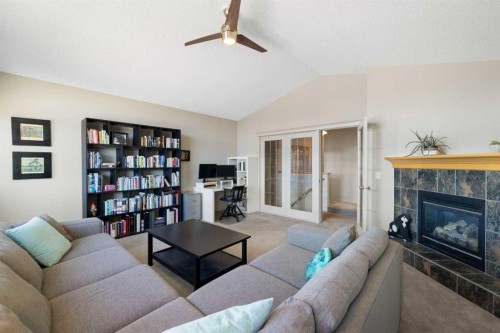 28 West Springs Close Sw, Calgary, AB - Indoor Photo Showing Living Room With Fireplace