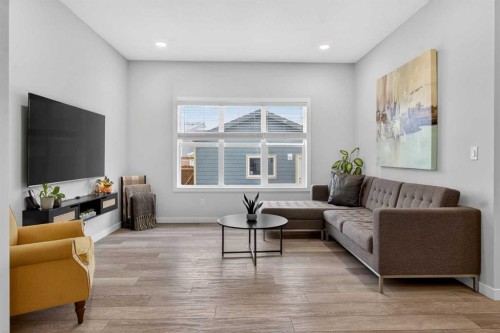 321 Magnolia Way Se, Calgary, AB - Indoor Photo Showing Living Room