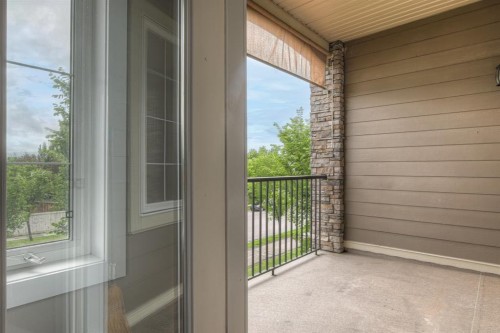 208-100 Cranfield Common Se, Calgary, AB - Outdoor With Balcony With Exterior