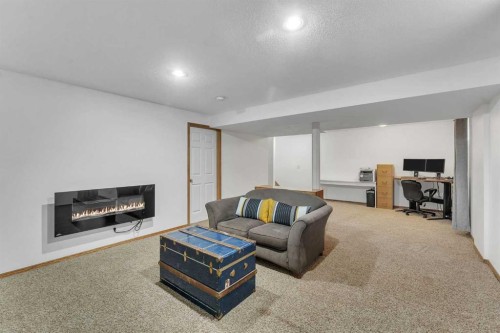 52 Covewood Green Ne, Calgary, AB - Indoor Photo Showing Living Room With Fireplace