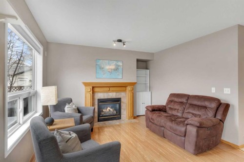 52 Covewood Green Ne, Calgary, AB - Indoor Photo Showing Living Room With Fireplace