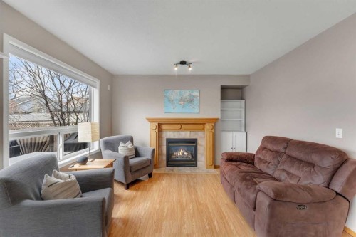 52 Covewood Green Ne, Calgary, AB - Indoor Photo Showing Living Room With Fireplace