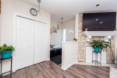 39 Tararidge Drive Ne, Calgary, AB - Indoor Photo Showing Other Room With Fireplace