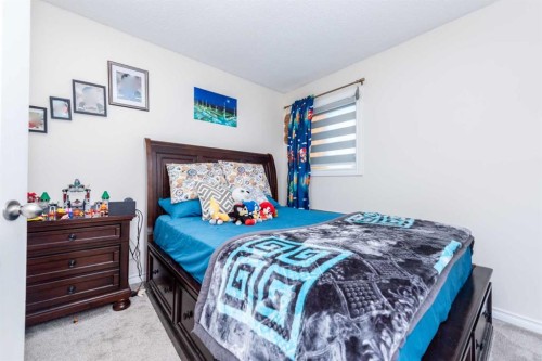 39 Tararidge Drive Ne, Calgary, AB - Indoor Photo Showing Bedroom