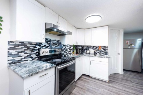39 Tararidge Drive Ne, Calgary, AB - Indoor Photo Showing Kitchen With Stainless Steel Kitchen With Upgraded Kitchen