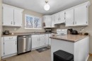 27 Bedford Road Ne, Calgary, AB  - Indoor Photo Showing Kitchen With Double Sink 