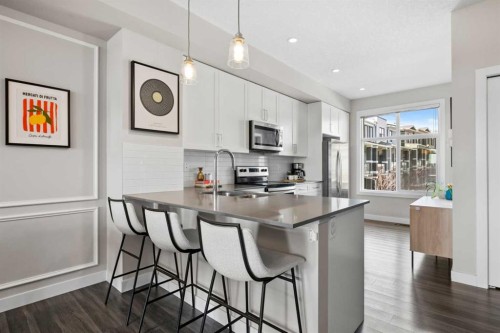 126 Seton Passage Se, Calgary, AB - Indoor Photo Showing Kitchen With Double Sink With Upgraded Kitchen