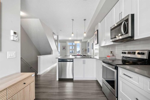 126 Seton Passage Se, Calgary, AB - Indoor Photo Showing Kitchen With Upgraded Kitchen