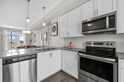126 Seton Passage Se, Calgary, AB - Indoor Photo Showing Kitchen With Double Sink With Upgraded Kitchen