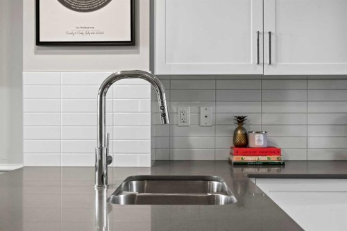 126 Seton Passage Se, Calgary, AB - Indoor Photo Showing Kitchen With Double Sink