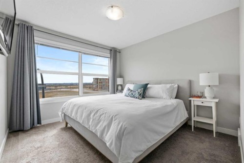 126 Seton Passage Se, Calgary, AB - Indoor Photo Showing Bedroom
