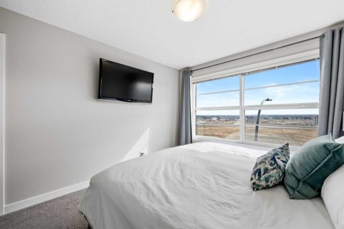 126 Seton Passage Se, Calgary, AB - Indoor Photo Showing Bedroom