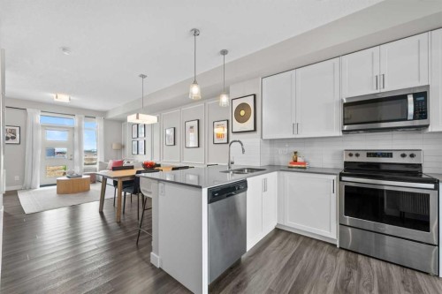 126 Seton Passage Se, Calgary, AB - Indoor Photo Showing Kitchen With Double Sink With Upgraded Kitchen