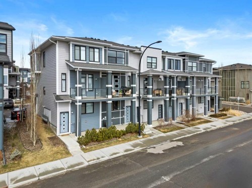 126 Seton Passage Se, Calgary, AB - Outdoor With Balcony With Facade