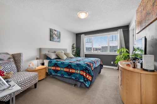 203 Fireside Parkway, Cochrane, AB - Indoor Photo Showing Bedroom
