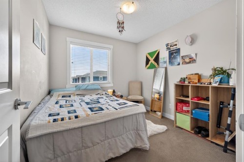 203 Fireside Parkway, Cochrane, AB - Indoor Photo Showing Bedroom