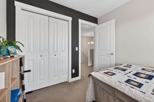 203 Fireside Parkway, Cochrane, AB - Indoor Photo Showing Bedroom