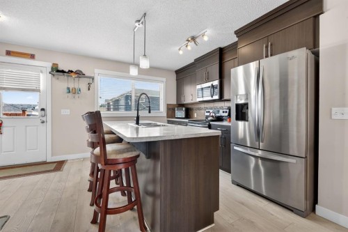203 Fireside Parkway, Cochrane, AB - Indoor Photo Showing Kitchen With Stainless Steel Kitchen