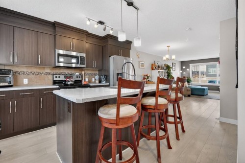 203 Fireside Parkway, Cochrane, AB - Indoor Photo Showing Kitchen With Stainless Steel Kitchen With Upgraded Kitchen
