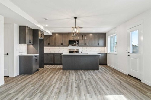 26A Poplar Ridge Close, Didsbury, AB - Indoor Photo Showing Kitchen With Upgraded Kitchen