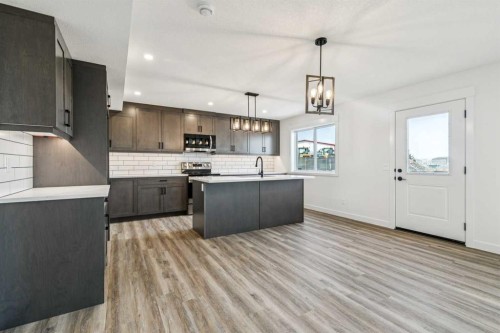 26A Poplar Ridge Close, Didsbury, AB - Indoor Photo Showing Kitchen With Upgraded Kitchen