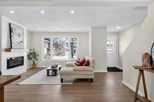 5 Bermuda Lane Nw, Calgary, AB - Indoor Photo Showing Living Room With Fireplace