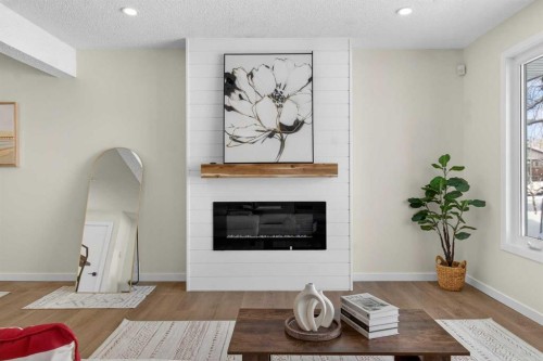 5 Bermuda Lane Nw, Calgary, AB - Indoor Photo Showing Living Room With Fireplace