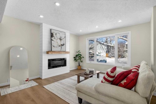 5 Bermuda Lane Nw, Calgary, AB - Indoor Photo Showing Living Room With Fireplace