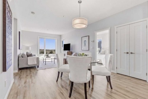 301-71 Shawnee Common Sw, Calgary, AB - Indoor Photo Showing Dining Room