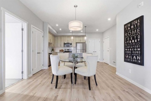301-71 Shawnee Common Sw, Calgary, AB - Indoor Photo Showing Dining Room