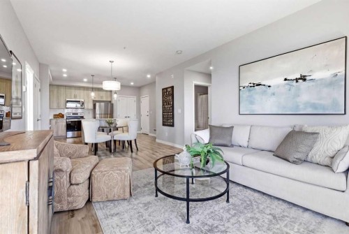 301-71 Shawnee Common Sw, Calgary, AB - Indoor Photo Showing Living Room