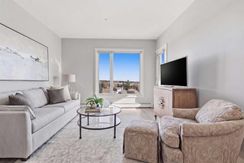 301-71 Shawnee Common Sw, Calgary, AB - Indoor Photo Showing Living Room