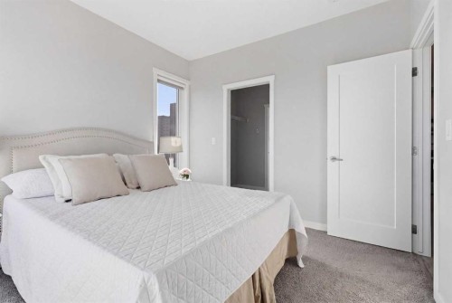 301-71 Shawnee Common Sw, Calgary, AB - Indoor Photo Showing Bedroom