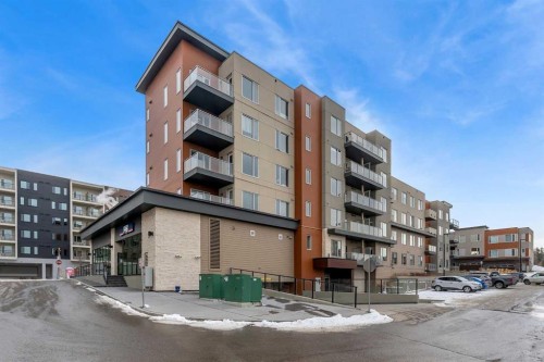 301-71 Shawnee Common Sw, Calgary, AB - Outdoor With Balcony With Facade