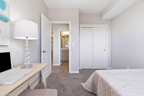 301-71 Shawnee Common Sw, Calgary, AB - Indoor Photo Showing Bedroom