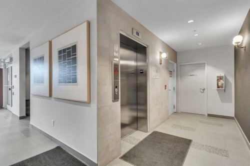 301-71 Shawnee Common Sw, Calgary, AB - Indoor Photo Showing Other Room