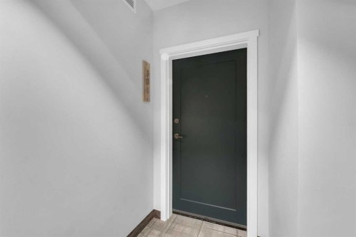 301-71 Shawnee Common Sw, Calgary, AB - Indoor Photo Showing Other Room