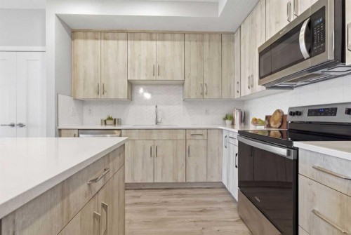 301-71 Shawnee Common Sw, Calgary, AB - Indoor Photo Showing Kitchen With Upgraded Kitchen