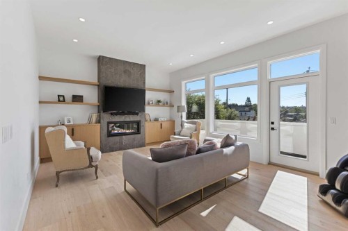 809 Drury Avenue Ne, Calgary, AB - Indoor Photo Showing Living Room With Fireplace