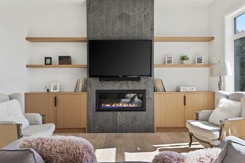 809 Drury Avenue Ne, Calgary, AB - Indoor Photo Showing Living Room With Fireplace
