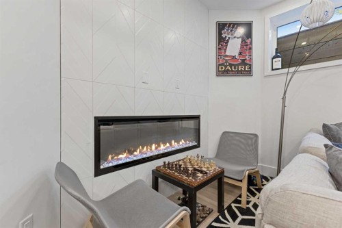 809 Drury Avenue Ne, Calgary, AB - Indoor Photo Showing Living Room With Fireplace