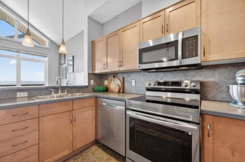 10-169 Rockyledge View Nw, Calgary, AB - Indoor Photo Showing Kitchen With Double Sink