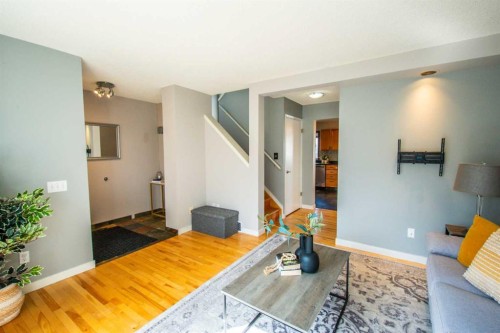 84 Hidden Green Nw, Calgary, AB - Indoor Photo Showing Living Room